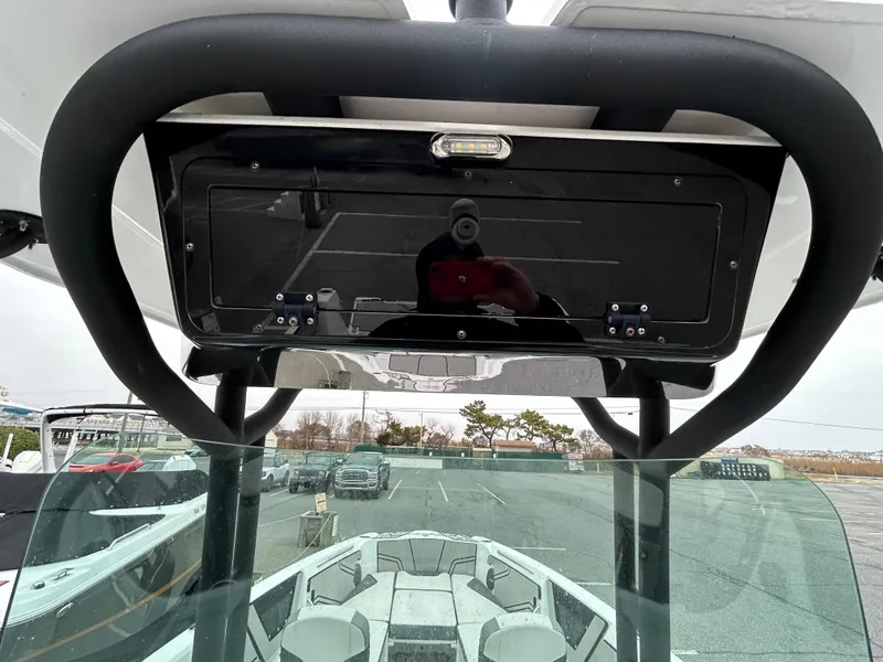 Slide: The Image of 2020 Scarab 255 Open ID boat interior with windshield and overhead console. - 6