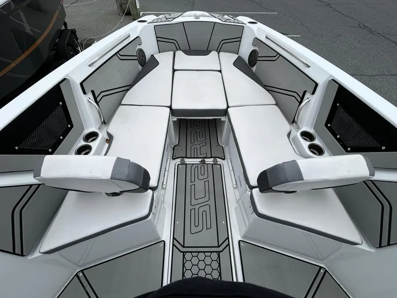 Slide: The Image of 2020 Scarab 255 Open ID boat interior with cushioned seating and cup holders. - 9