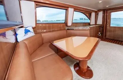 Slide: The Image of Luxurious interior of 2006 Viking 48 yacht with leather seating and ocean view. - 15