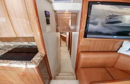 Slide: The Image of Interior of 2006 Viking 48 yacht with luxurious wood finish and modern amenities. - 22