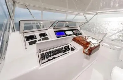 Slide: The Image of Helm of 2006 Viking 48 yacht with modern navigation equipment and ocean view. - 5