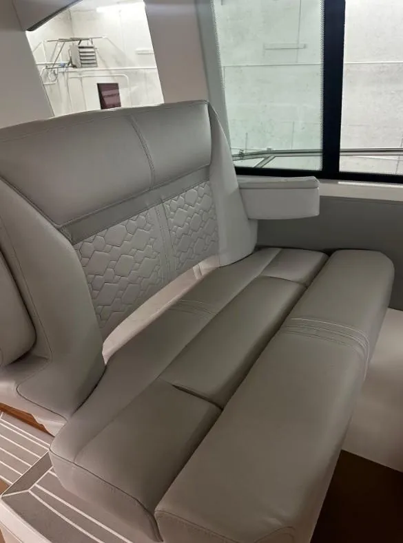 Slide: The Image of 2023 Tiara Yachts 43 LE interior seating with elegant gray upholstery. - 20