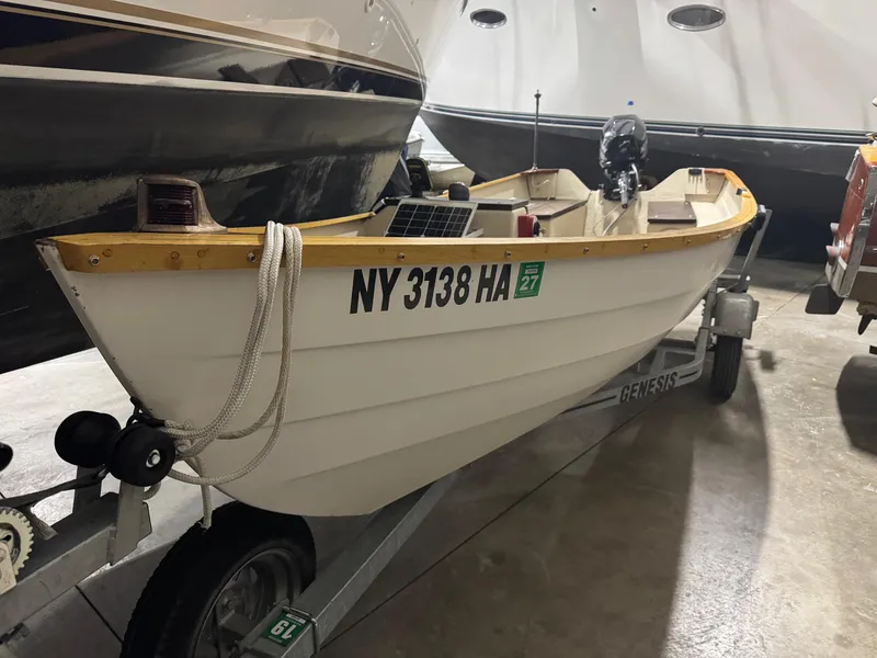 The Image of 1988 Stur-Dee Amesbury Dory 14' boat on trailer, stored indoors. - 0