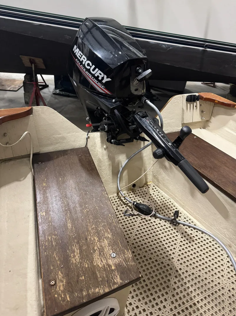 Slide: The Image of 1988 Stur-Dee Amesbury Dory boat interior with Mercury outboard motor. - 10