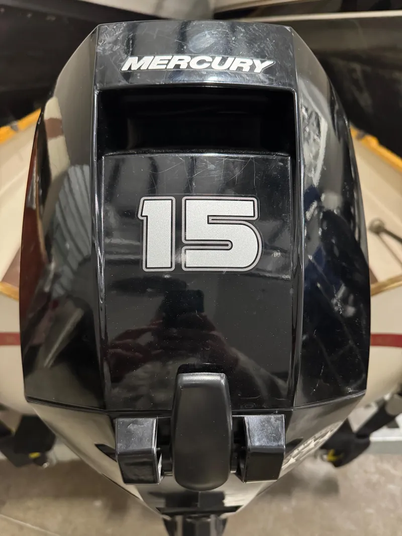 Slide: The Image of Mercury 15 horsepower outboard motor on a 1988 Stur-Dee Amesbury Dory boat. - 13