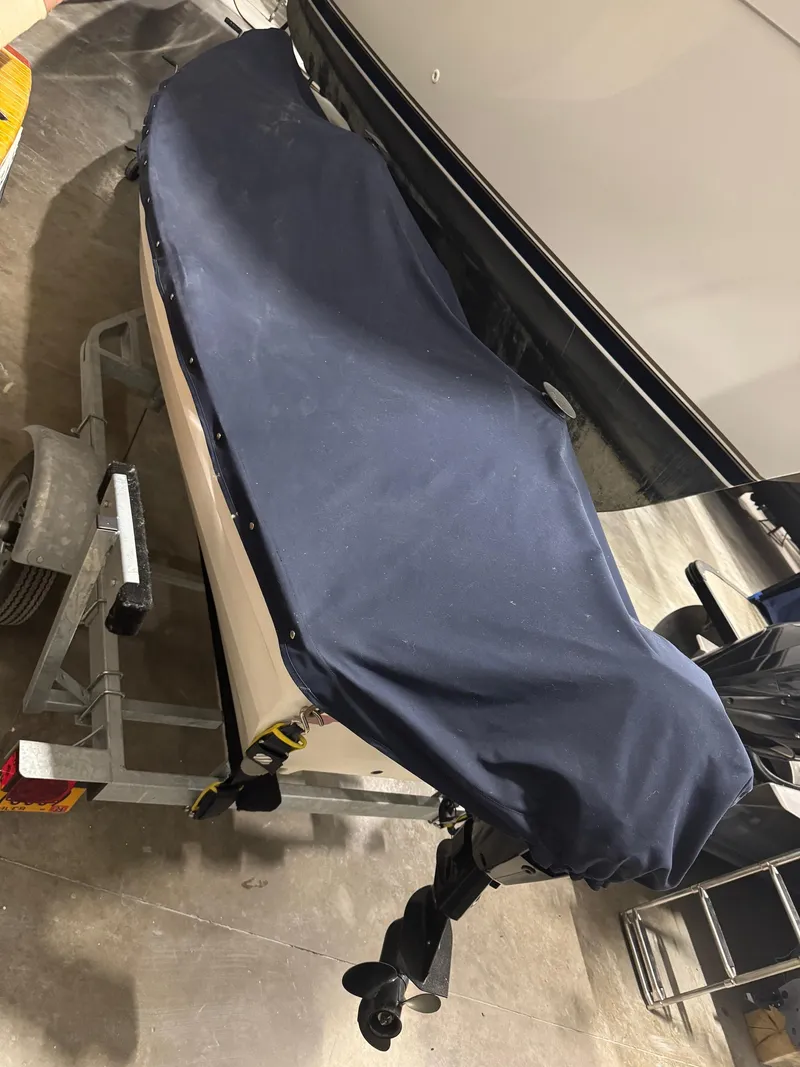 Slide: The Image of 1988 Stur-Dee Amesbury Dory 14' boat with cover on trailer. - 4