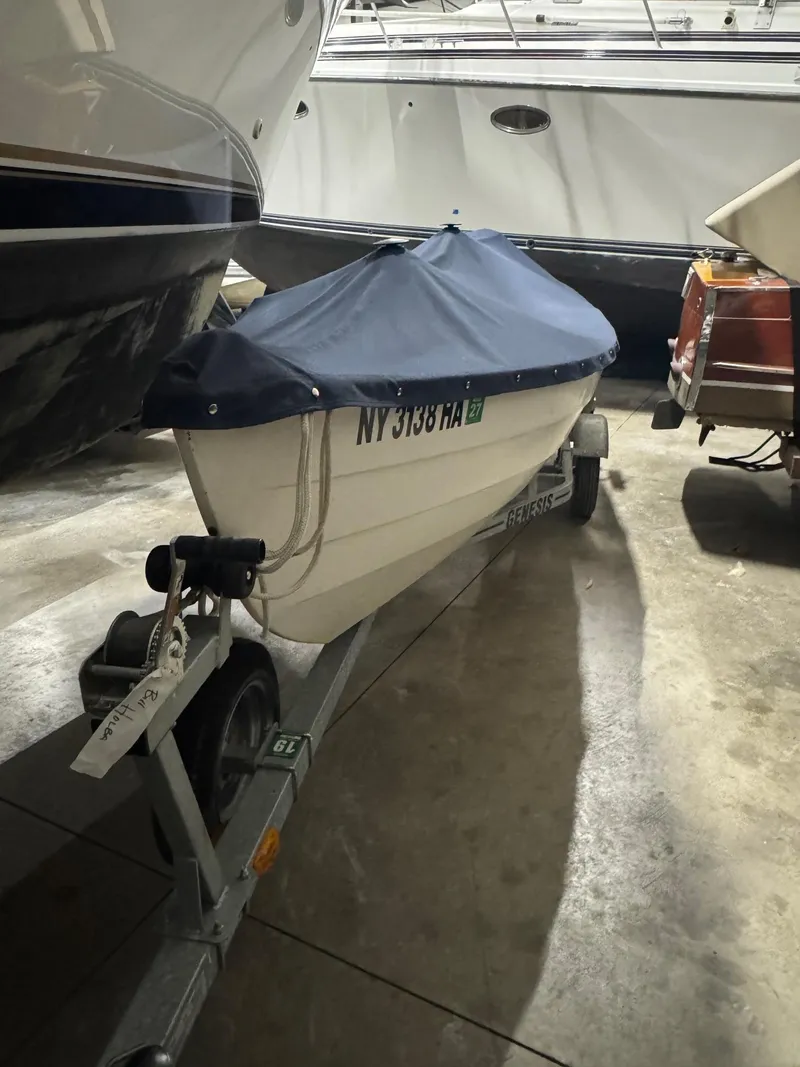 Slide: The Image of 1988 Stur-Dee Amesbury Dory 14' boat on trailer, covered and stored indoors. - 5