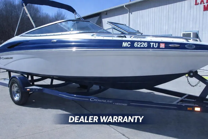 The Image of 2012 Crownline 21 SS boat on trailer with dealer warranty displayed. - 0