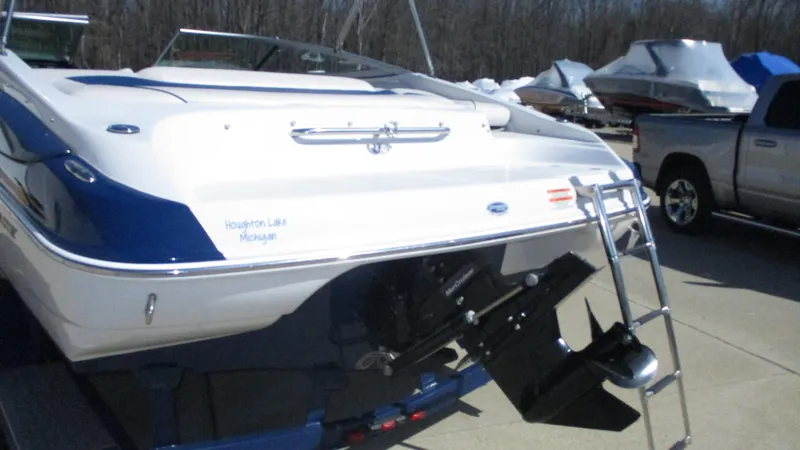 Slide: The Image of 2012 Crownline 21 SS boat interior with white seating and blue accents. - 3