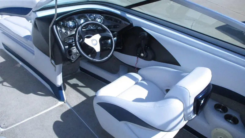 Slide: The Image of Interior of 2012 Crownline 21 SS boat with white and blue seating. - 7