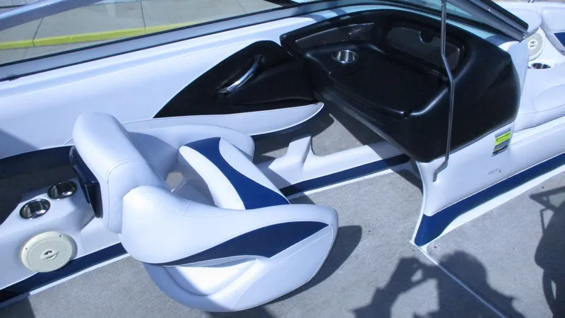 Slide: The Image of Interior view of 2012 Crownline 21 SS boat with white seating and speakers. - 8