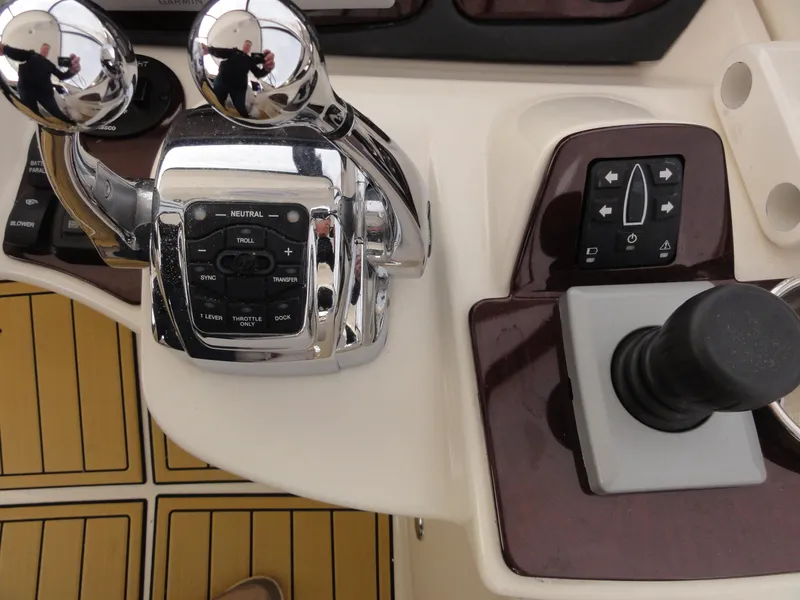 Slide: The Image of Control panel of a 2009 Meridian 441 Sedan yacht with throttle and joystick. - 19