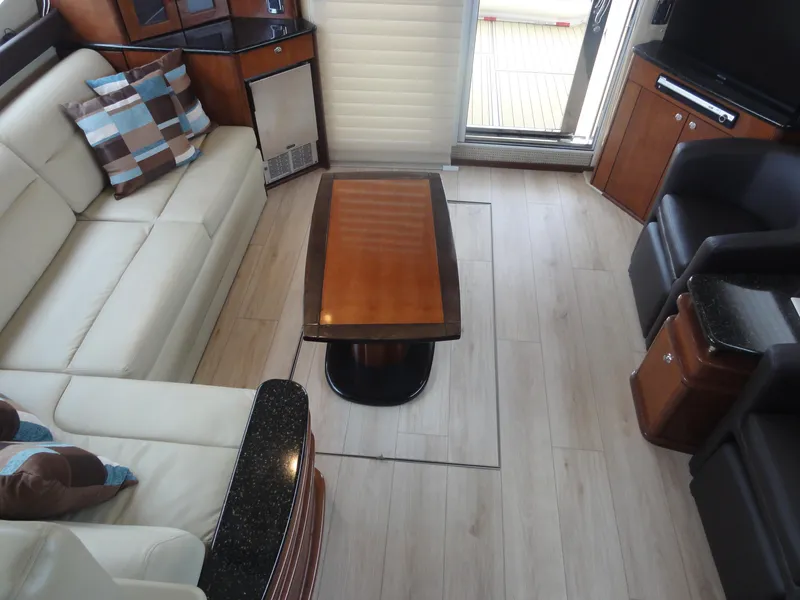 Slide: The Image of Interior of 2009 Meridian 441 Sedan with modern furnishings and wooden flooring. - 32