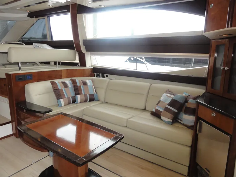 Slide: The Image of Luxurious interior of 2009 Meridian 441 Sedan yacht with plush seating and elegant wood finishes. - 37