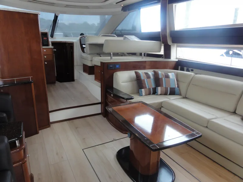 Slide: The Image of Luxurious interior of a 2009 Meridian 441 Sedan yacht with elegant seating and wooden finishes. - 38
