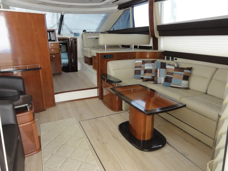 Slide: The Image of Luxurious interior of 2009 Meridian 441 Sedan yacht with elegant seating and wooden finishes. - 42