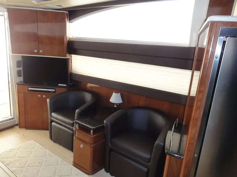 Slide: The Image of Interior of 2009 Meridian 441 Sedan yacht with leather chairs and TV. - 47