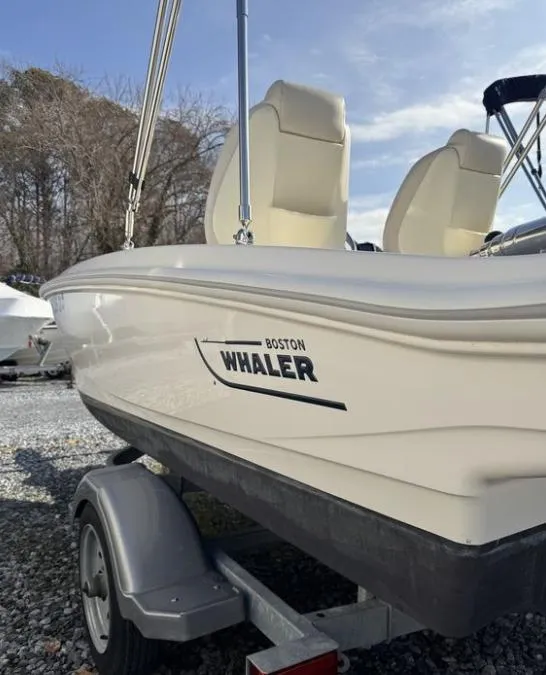 Slide: The Image of 2024 Boston Whaler 130 Super Sport boat on trailer, side view. - 20