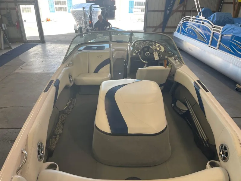 Slide: The Image of 2006 Nautique Ski 206 boat interior in a storage facility. - 15