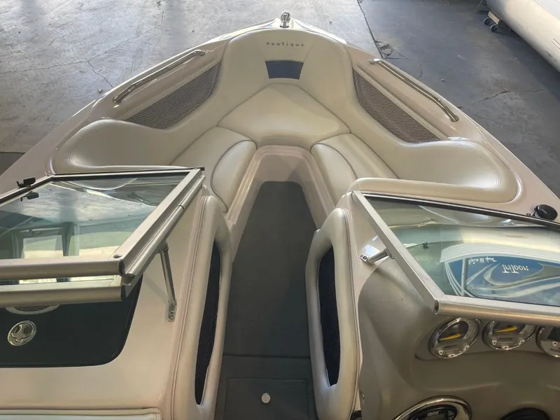 Slide: The Image of 2006 Nautique Ski 206 boat interior with open windshield and seating area. - 18