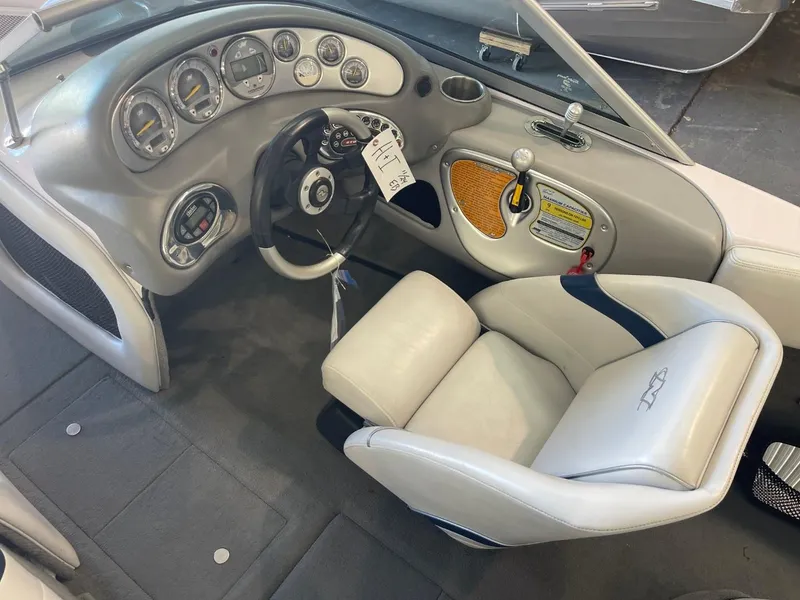 Slide: The Image of 2006 Nautique Ski 206 boat interior with steering wheel and dashboard controls. - 21