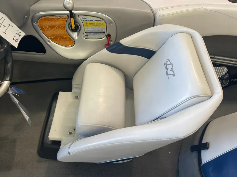 Slide: The Image of 2006 Nautique Ski 206 boat interior with white and blue seating. - 22