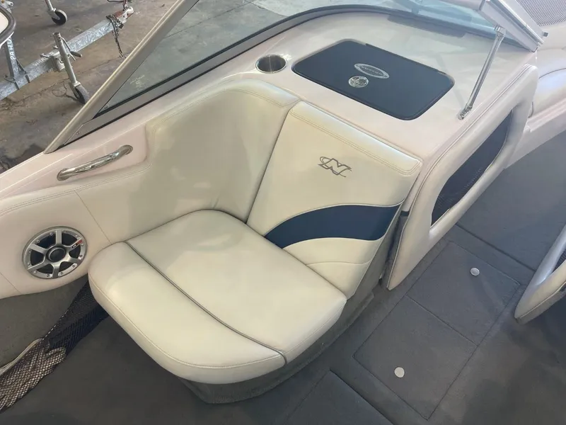 Slide: The Image of 2006 Nautique Ski 206 boat interior with white and blue seating. - 26