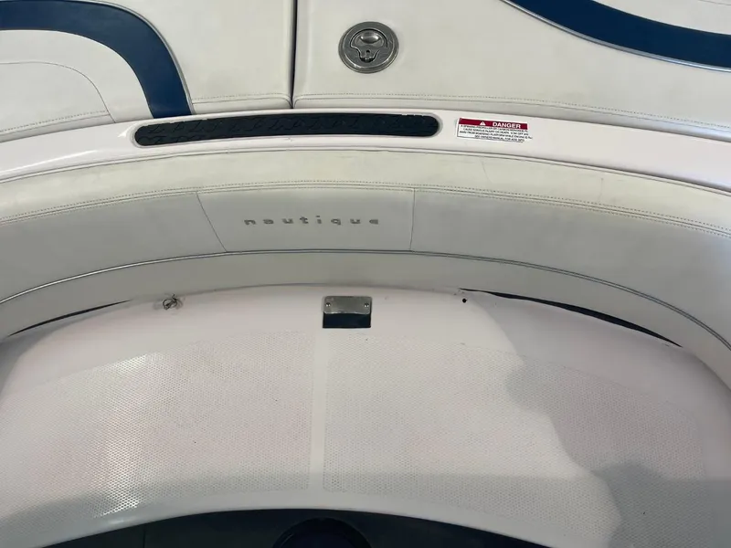 Slide: The Image of 2006 Nautique Ski 206 boat interior with white and blue upholstery. - 29