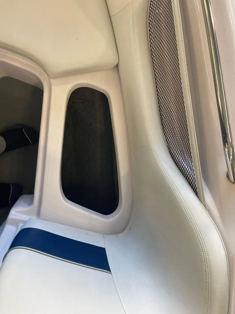 Slide: The Image of 2006 Nautique Ski 206 interior detail with white and blue upholstery. - 33