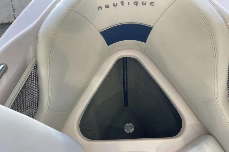 Slide: The Image of 2006 Nautique Ski 206 boat interior with white and blue seating. - 35