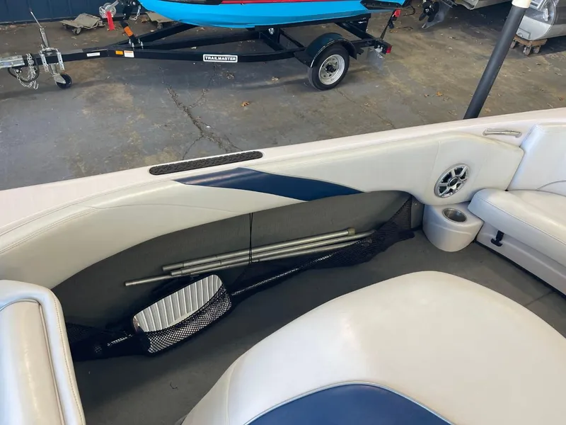 Slide: The Image of 2006 Nautique Ski 206 interior with storage compartment and speaker. - 36
