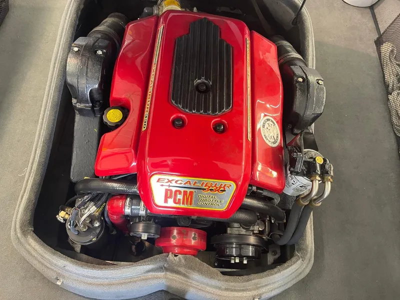 Slide: The Image of 2006 Nautique Ski 206 PCM engine with red cover, Excalibur 330 branding. - 38