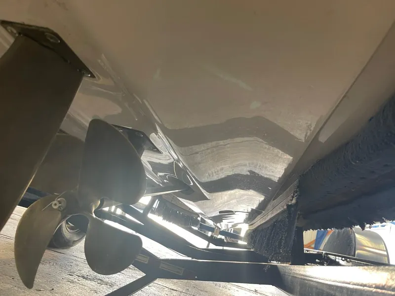 Slide: The Image of 2006 Nautique Ski 206 boat underside with propeller and trailer. - 7