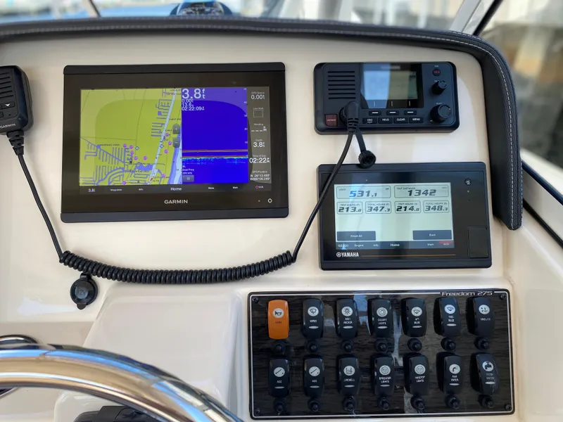 Slide: The Image of Control panel of 2019 Grady-White Freedom 275 with Garmin navigation system. - 7