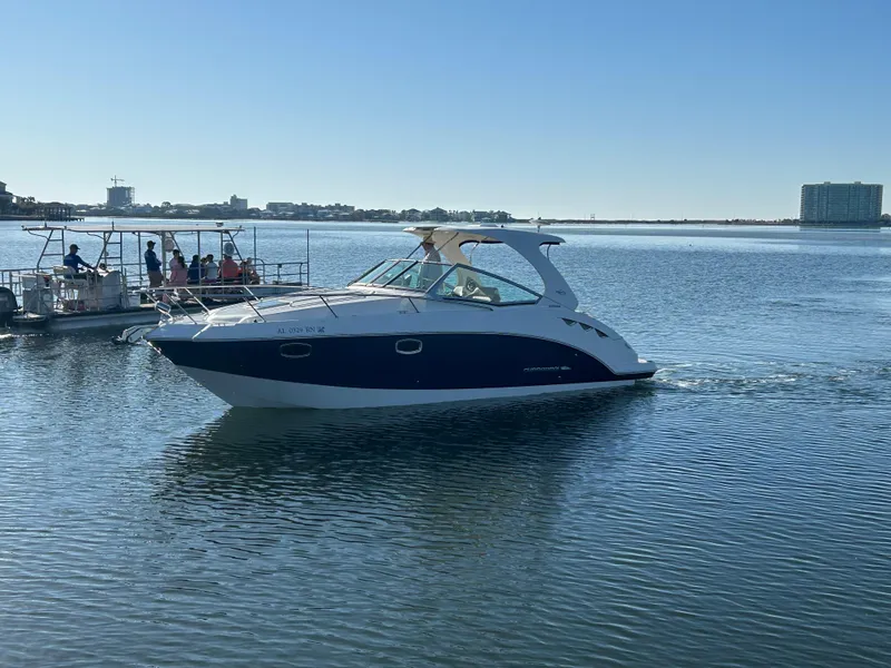 The Image of 2014 Chaparral 310 Signature Axis boat cruising on calm water. - 0