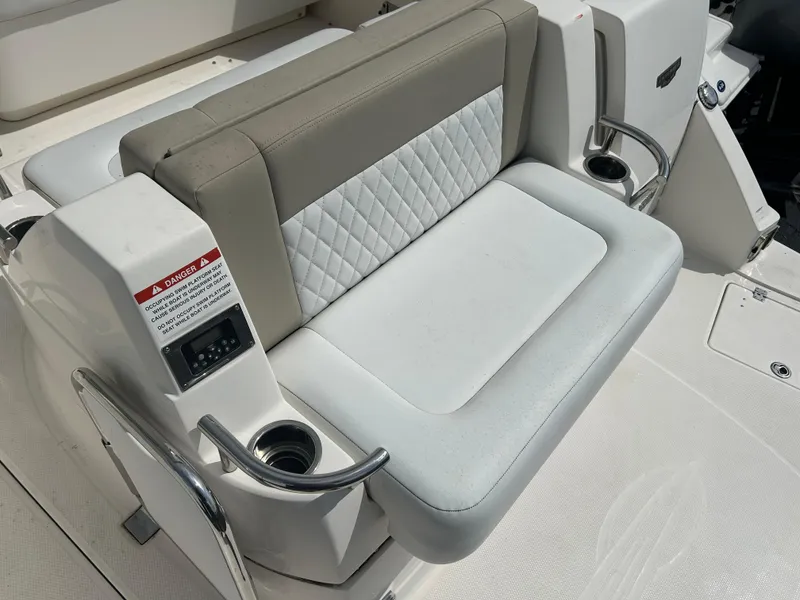 Slide: The Image of 2014 Chaparral 310 Signature boat seat with cup holders and quilted upholstery. - 16