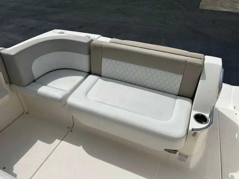 Slide: The Image of 2014 Chaparral 310 Signature boat seating with beige and white upholstery. - 18