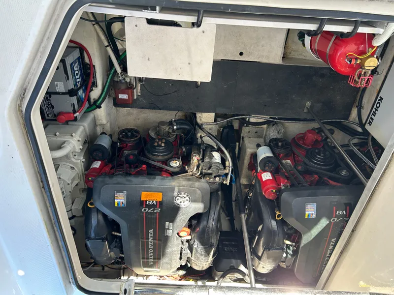 Slide: The Image of Engine compartment of 2014 Chaparral 310 Signature 310 Axis boat, featuring dual engines. - 34