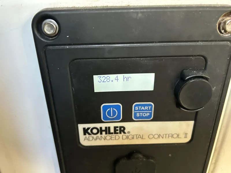 Slide: The Image of Kohler Advanced Digital Control II displaying 328.4 hours on Chaparral 310 Signature 310 Axis, 2014. - 37