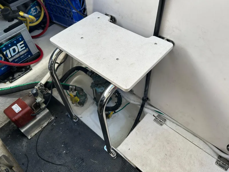 Slide: The Image of Engine compartment of 2014 Chaparral 310 Signature with battery and equipment. - 40