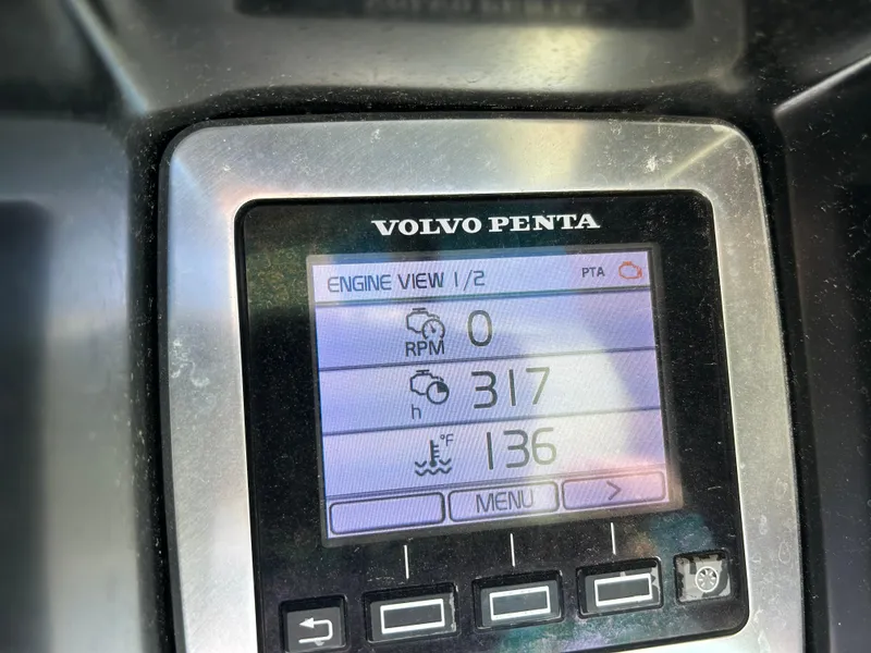 Slide: The Image of Volvo Penta engine display on 2014 Chaparral 310 Signature, showing RPM and temperature. - 42