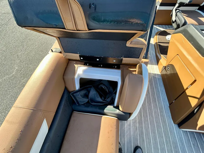 Slide: The Image of Brown leather seating with storage compartment on a 2021 Berkshire 25RFX DC STS 3.0+ boat. - 11