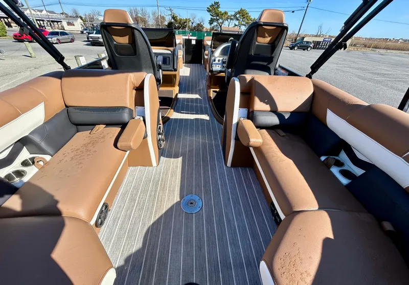 Slide: The Image of 2021 Berkshire 25RFX DC STS 3.0+ pontoon boat interior with tan seating and modern design. - 14