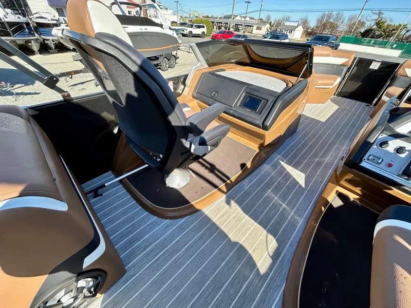 Slide: The Image of 2021 Berkshire 25RFX DC STS 3.0+ boat interior with modern helm and seating. - 16