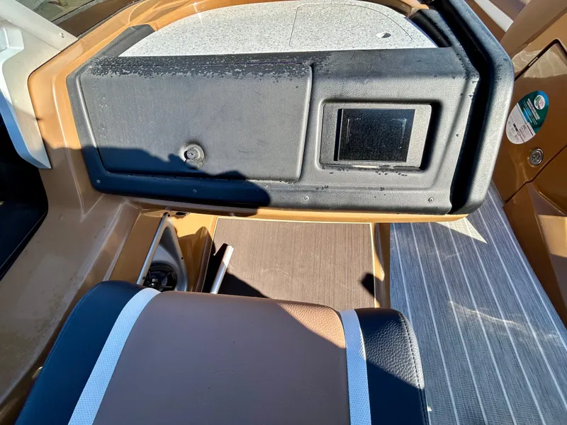 Slide: The Image of Interior view of a 2021 Berkshire 25RFX DC STS 3.0+ boat with seating and dashboard. - 18