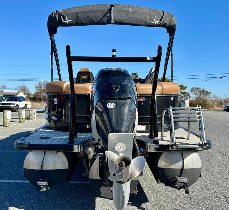 Slide: The Image of 2021 Berkshire 25RFX DC STS 3.0+ pontoon boat, rear view with motor and ladder. - 23