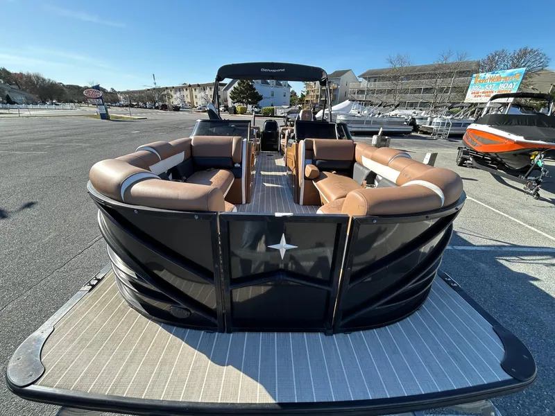 Slide: The Image of 2021 Berkshire 25RFX DC STS 3.0+ pontoon boat with spacious seating, parked outdoors. - 4