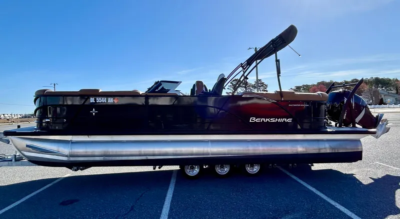 Slide: The Image of 2021 Berkshire 25RFX DC STS 3.0+ pontoon boat parked on a sunny day. - 6
