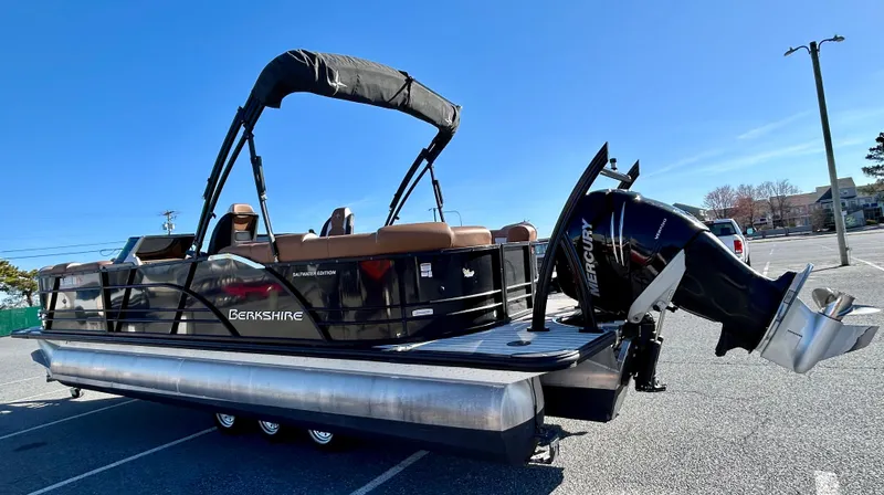Slide: The Image of 2021 Berkshire 25RFX DC STS 3.0+ pontoon boat with Mercury outboard in a parking lot. - 7