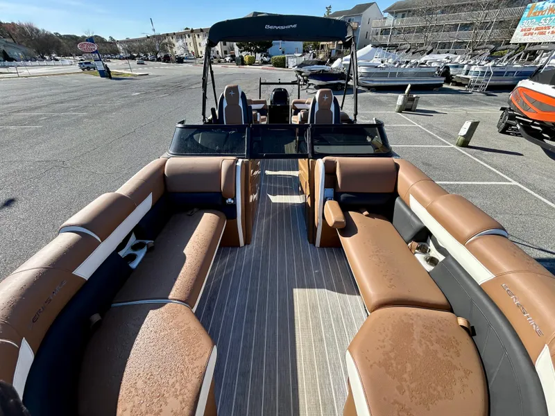 Slide: The Image of 2021 Berkshire 25RFX DC STS 3.0+ pontoon boat with spacious seating in a marina. - 8